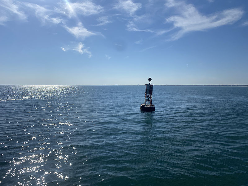 Calm ocean waters offshore of North Carolina during a peaceful burial at sea service